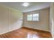 Bedroom with hardwood floors, a window, and closet space at 5739 Cobb Mdw, Norcross, GA 30093