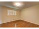 Cozy bedroom with hardwood floors and window, creating a comfortable atmosphere at 5739 Cobb Mdw, Norcross, GA 30093