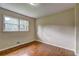 Cozy bedroom featuring hardwood floors and natural light from a double window at 5739 Cobb Mdw, Norcross, GA 30093