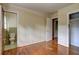Bedroom with hardwood floors, a closet, and an attached bathroom for added convenience at 5739 Cobb Mdw, Norcross, GA 30093