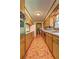 Traditional-style kitchen featuring wooden cabinets, tile flooring, and updated appliances at 5739 Cobb Mdw, Norcross, GA 30093