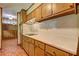 Kitchen view showcasing countertops, cabinets, and access to other rooms at 5739 Cobb Mdw, Norcross, GA 30093