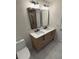 Bright bathroom featuring a double sink vanity with black hardware and a luxurious marble countertop at 602 Birch River Ln, Lawrenceville, GA 30043