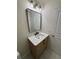 Modern bathroom featuring a single sink vanity with black hardware and a luxurious marble countertop at 602 Birch River Ln, Lawrenceville, GA 30043