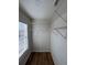Well-organized walk-in closet with shelving and a window for natural light at 602 Birch River Ln, Lawrenceville, GA 30043