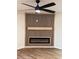 Bright living room boasting sleek fireplace and modern ceiling fan at 602 Birch River Ln, Lawrenceville, GA 30043
