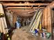 Raw interior space with exposed wood framing, unfinished ceiling, and a clutter of building materials, ready for renovation at 1891 Bennett Rd, Grayson, GA 30017