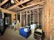 Interior view of an unfinished room showing exposed framing, wood floors and some boxes at 1891 Bennett Rd, Grayson, GA 30017