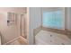 Relaxing bathroom featuring a jacuzzi tub and separate shower, perfect for unwinding after a long day at 450 Hunt Creek Dr, Acworth, GA 30101