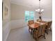 Formal dining room with elegant chandelier, wainscoting, and a large window at 450 Hunt Creek Dr, Acworth, GA 30101