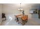 Inviting dining room with classic chandelier and adjacent kitchen at 450 Hunt Creek Dr, Acworth, GA 30101