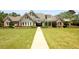 Well-maintained home exterior featuring a large front lawn, attractive landscaping and architectural design elements at 450 Hunt Creek Dr, Acworth, GA 30101
