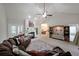 Spacious living room with vaulted ceiling, fireplace, large sectional sofa, and adjacent dining area at 450 Hunt Creek Dr, Acworth, GA 30101