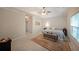 Spacious main bedroom featuring a ceiling fan, carpet, and windows providing natural light at 450 Hunt Creek Dr, Acworth, GA 30101
