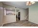 Dining room view showcases the kitchen with vinyl flooring and light fixtures at 5026 Brittany Dr, Stone Mountain, GA 30083