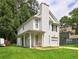 View of the front exterior of the charming two-story home with a well-manicured lawn at 5026 Brittany Dr, Stone Mountain, GA 30083