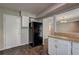 Spacious kitchen with a refrigerator and an open layout leading to the dining area at 5026 Brittany Dr, Stone Mountain, GA 30083