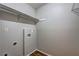 Compact laundry area with vinyl wood flooring and washer and dryer hookups at 5026 Brittany Dr, Stone Mountain, GA 30083
