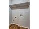 Compact laundry area with vinyl wood flooring and washer and dryer hookups at 5026 Brittany Dr, Stone Mountain, GA 30083