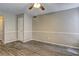 Bright living room boasts wood-look flooring and neutral paint, ready for your personal touch at 5026 Brittany Dr, Stone Mountain, GA 30083