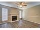 Cozy living room features wood-look flooring and a fireplace, perfect for gatherings at 5026 Brittany Dr, Stone Mountain, GA 30083