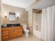 Well-lit bathroom with a vanity, toilet, and shower with tan colored walls at 57 Forsyth Nw St # 16G, Atlanta, GA 30303