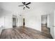 Sun-filled bedroom boasting hardwood floors, high ceilings, ceiling fan and multiple doorways at 57 Forsyth Nw St # 16G, Atlanta, GA 30303