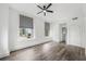 Bedroom featuring beautiful hardwood floors, neutral paint and large windows with blinds at 57 Forsyth Nw St # 16G, Atlanta, GA 30303