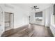 Large primary bedroom with hardwood floors, ample closet space, and an ensuite bathroom at 57 Forsyth Nw St # 16G, Atlanta, GA 30303