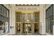 Elegant building entrance with a gold revolving door and the words 'Healey Building' above at 57 Forsyth Nw St # 16G, Atlanta, GA 30303