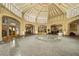Expansive lobby of the building with architectural arches and a polished floor at 57 Forsyth Nw St # 16G, Atlanta, GA 30303