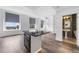 Bright living room features large windows, hardwood floors and an island cooktop at 57 Forsyth Nw St # 16G, Atlanta, GA 30303