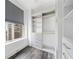 View of a well-organized walk-in closet with gray cabinets and hardwood flooring at 57 Forsyth Nw St # 16G, Atlanta, GA 30303