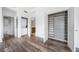 Bright walk-in closet featuring hardwood floors, custom shelving, closet, and laundry area at 57 Forsyth Nw St # 16G, Atlanta, GA 30303