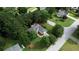 Aerial view of a single-Gathering home surrounded by mature trees, landscaping, and a well-manicured lawn at 1248 Rockview Ct, Loganville, GA 30052