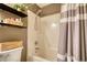 Bathroom with bath/shower combination and decorative shelving at 1248 Rockview Ct, Loganville, GA 30052