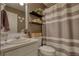 Bathroom with vanity, decor, toilet, and striped shower curtain at 1248 Rockview Ct, Loganville, GA 30052