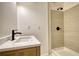 Modern bathroom with sleek vanity, updated lighting, and a tiled walk-in shower at 1248 Rockview Ct, Loganville, GA 30052