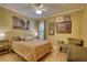 Charming bedroom with hardwood floors, natural light, and chair seating at 1248 Rockview Ct, Loganville, GA 30052