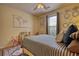 Cozy bedroom with ample decor and a comfortable looking bed at 1248 Rockview Ct, Loganville, GA 30052