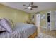 Comfortable bedroom with natural light, carpeted floors, and neutral decor, creating a relaxing atmosphere at 1248 Rockview Ct, Loganville, GA 30052