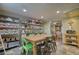 Bright dining area featuring table, open storage shelving and access to additional living spaces at 1248 Rockview Ct, Loganville, GA 30052