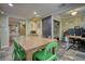 Open dining area featuring slate tile flooring, desk area, and adjacent rooms in a naturally lit room at 1248 Rockview Ct, Loganville, GA 30052