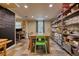 Spacious dining area with chalkboard, table, shelving and bright light with access to exterior views at 1248 Rockview Ct, Loganville, GA 30052