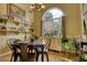 Bright dining room with natural light, plants, and a rustic table, perfect for entertaining at 1248 Rockview Ct, Loganville, GA 30052