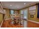 Beautiful dining area with hardwood floors, natural light, and seating for Gathering meals at 1248 Rockview Ct, Loganville, GA 30052
