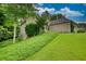 Charming single-Gathering home with a well-manicured lawn and lush greenery surrounding the property at 1248 Rockview Ct, Loganville, GA 30052