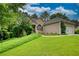 Single Gathering home with manicured lawn, trimmed landscaping, and a two-car attached garage at 1248 Rockview Ct, Loganville, GA 30052