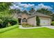 Charming single-Gathering home with manicured lawn, lush landscaping, and a two-car attached garage at 1248 Rockview Ct, Loganville, GA 30052
