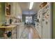 Well-lit kitchen with white cabinets, matching countertop, and appliances, complemented by a practical and inviting space at 1248 Rockview Ct, Loganville, GA 30052